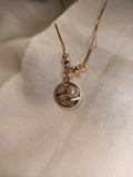 Elegant Gold Pendant Necklace with Hand Motif